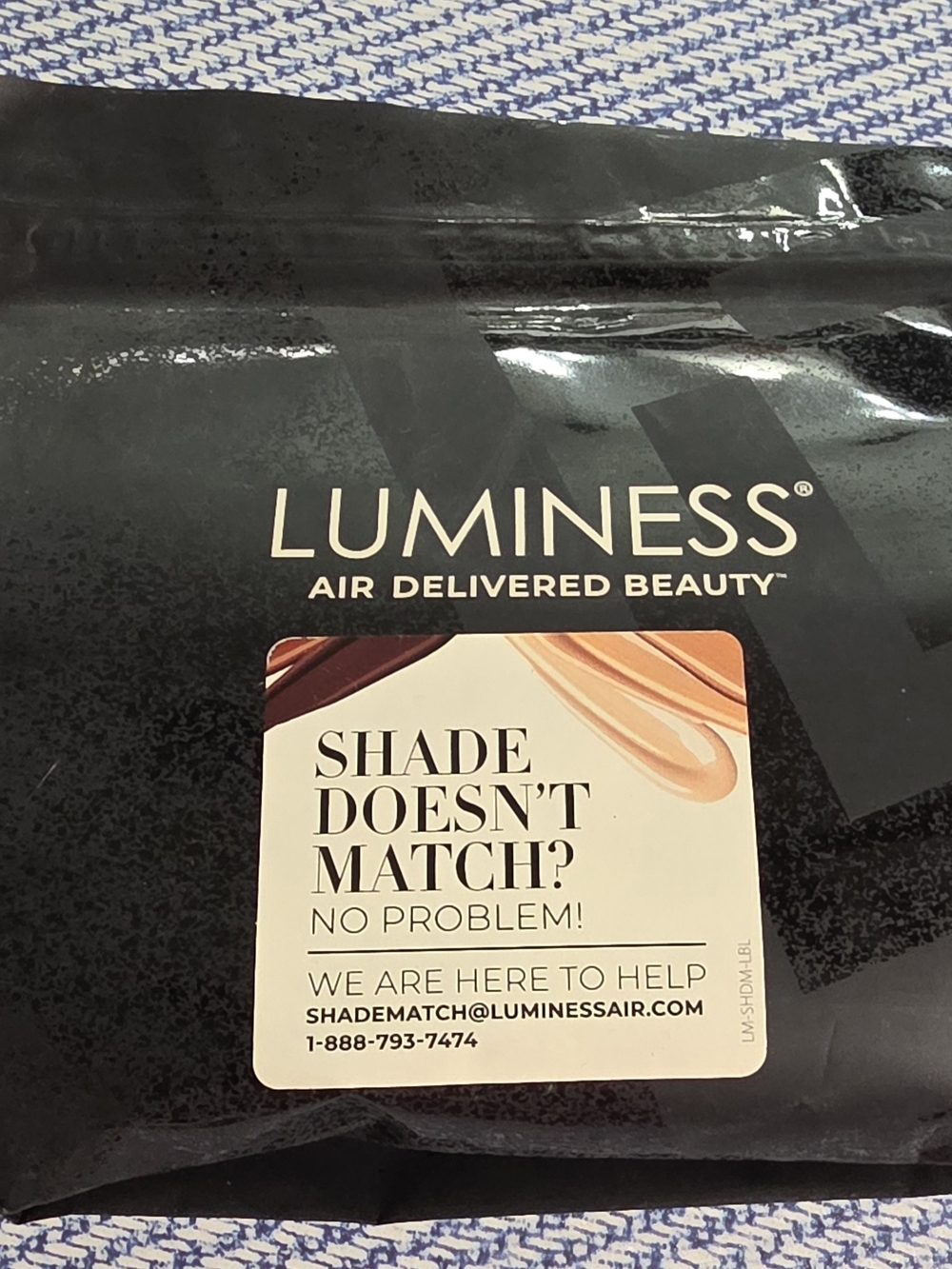 Luminess Black Makeup Packaging with Cream and Tan Accent